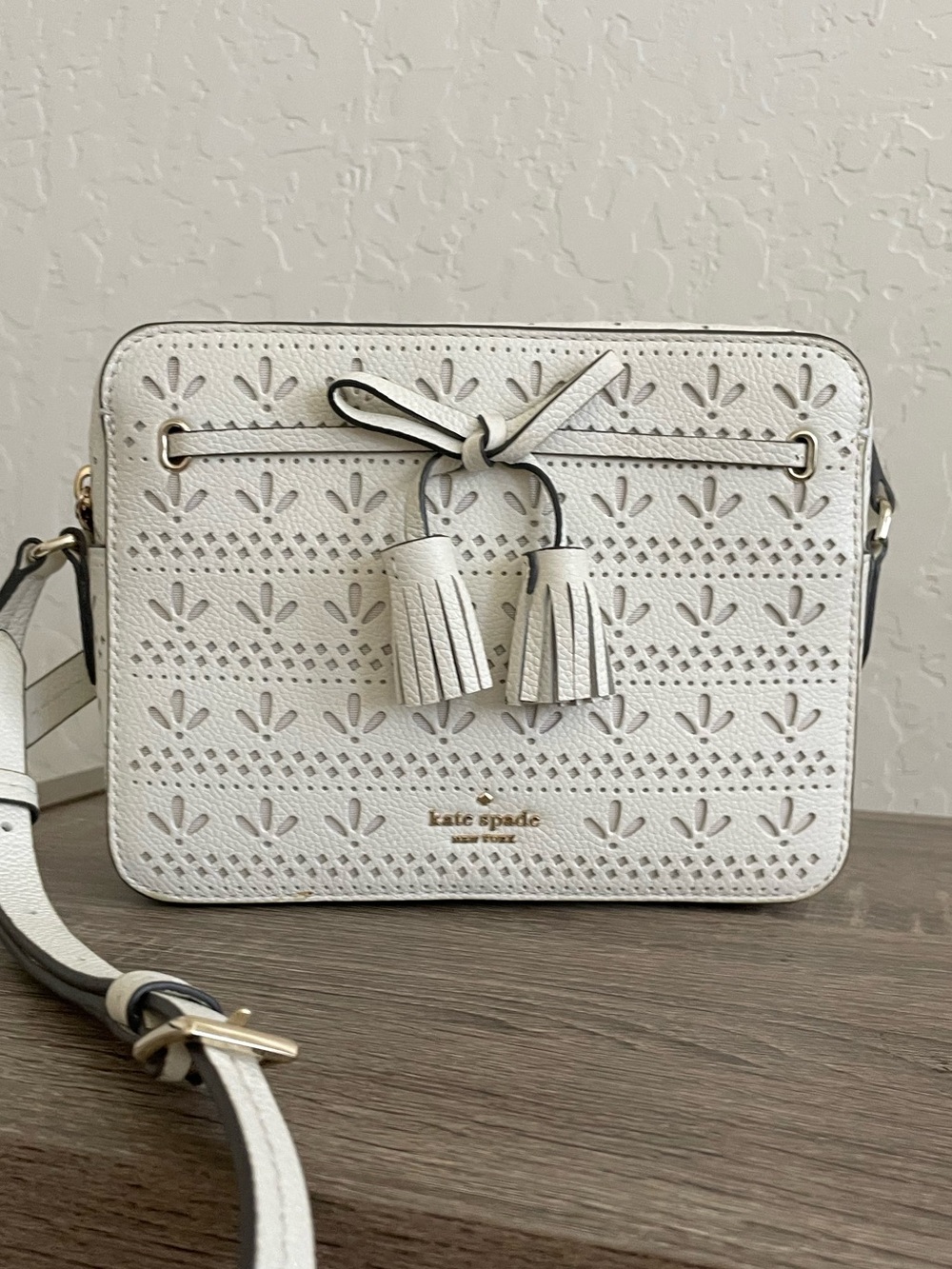 Kate Spade New York Perforated Tassel Camera Crossbody Bag – White/Cream